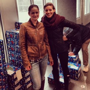 Santa Fund: Amanda Gun-Munro and Nichole Legate at the depot picking up their gift boxes.